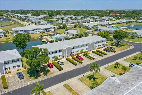 an aerial view of residential houses with outdoor space