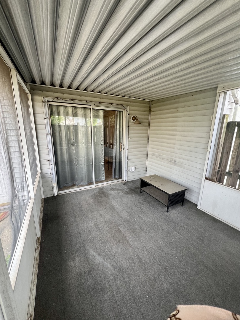 2350 Carnation Drive, Unit 4 Crest Hill, IL 60403 - Photo 14 of 19 a view of an empty room with a fireplace