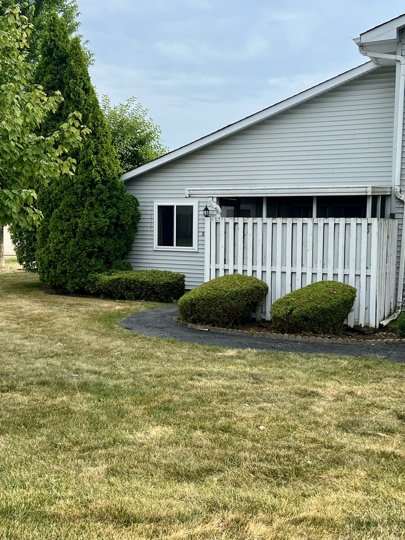 2350 Carnation Drive, Unit 4 Crest Hill, IL 60403 - Photo 16 of 19 a view of a house with backyard and plants