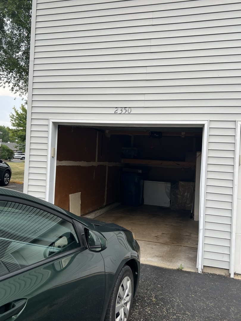 2350 Carnation Drive, Unit 4 Crest Hill, IL 60403 - Photo 18 of 19 a car parked in front of a house