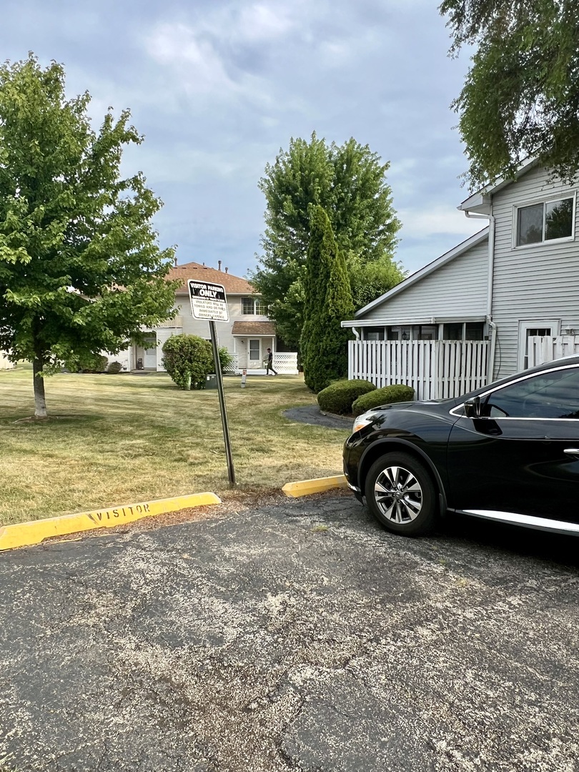2350 Carnation Drive, Unit 4 Crest Hill, IL 60403 - Photo 19 of 19 a view of a house with swimming pool and garden