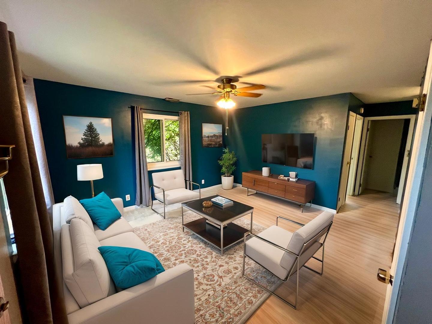 2350 Carnation Drive, Unit 4 Crest Hill, IL 60403 - Photo 2 of 19 a living room with furniture and a large mirror