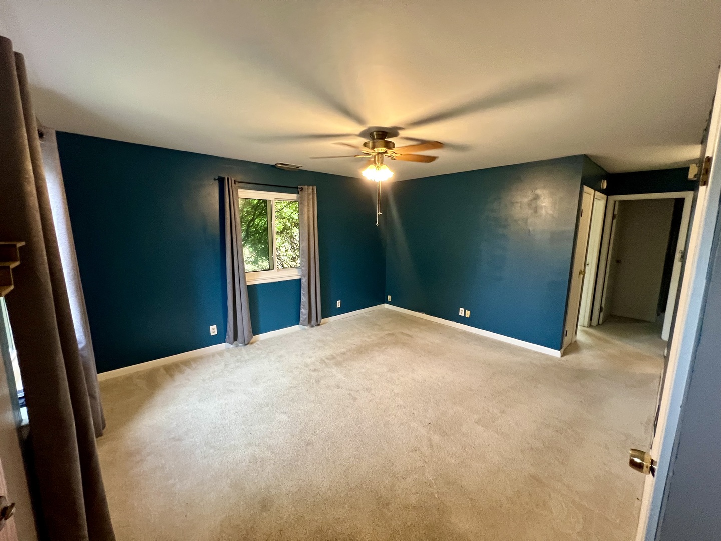 2350 Carnation Drive, Unit 4 Crest Hill, IL 60403 - Photo 3 of 19 a view of empty room with window and ceiling fan