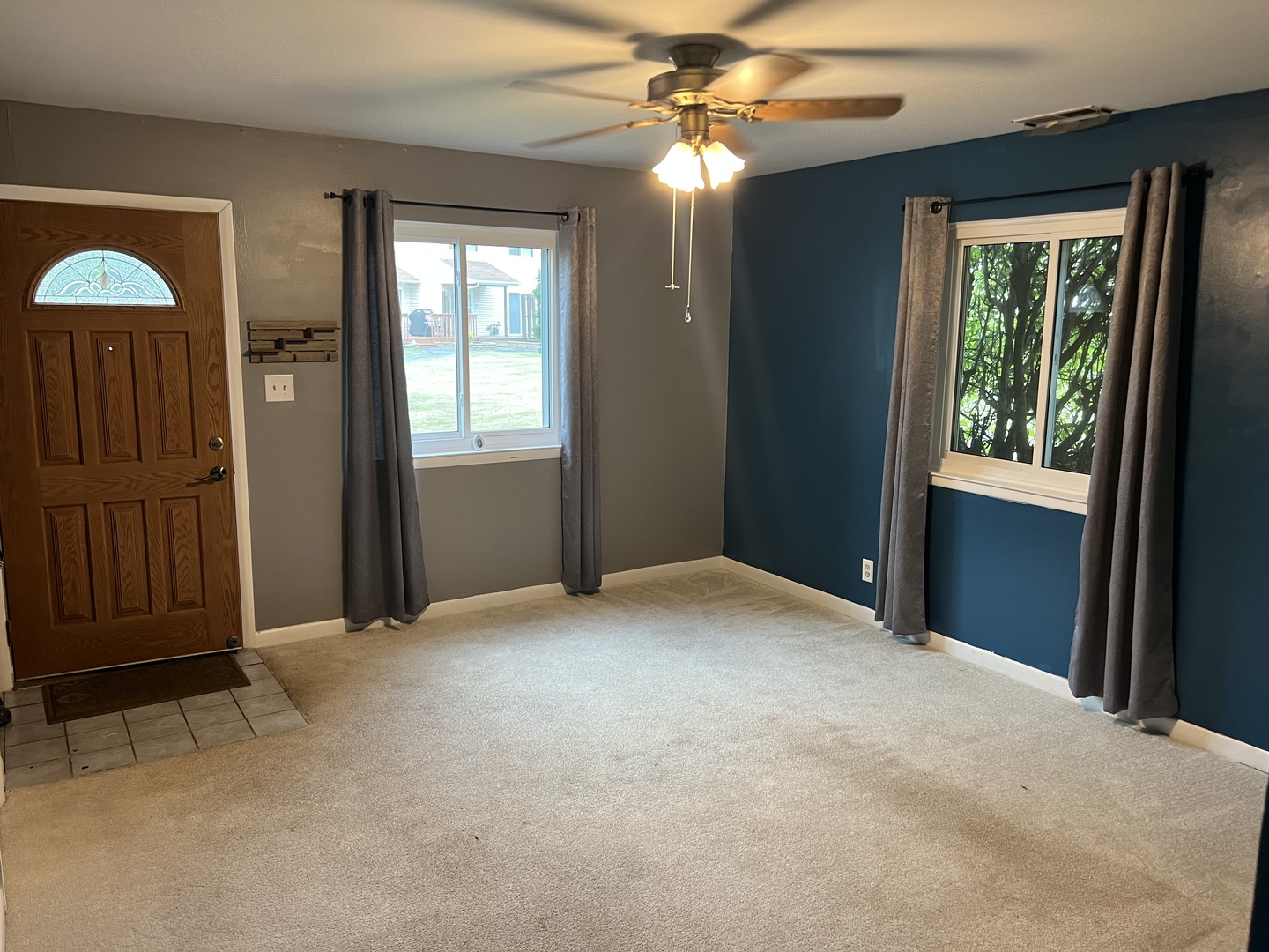 2350 Carnation Drive, Unit 4 Crest Hill, IL 60403 - Photo 4 of 19 an empty room with windows and closet