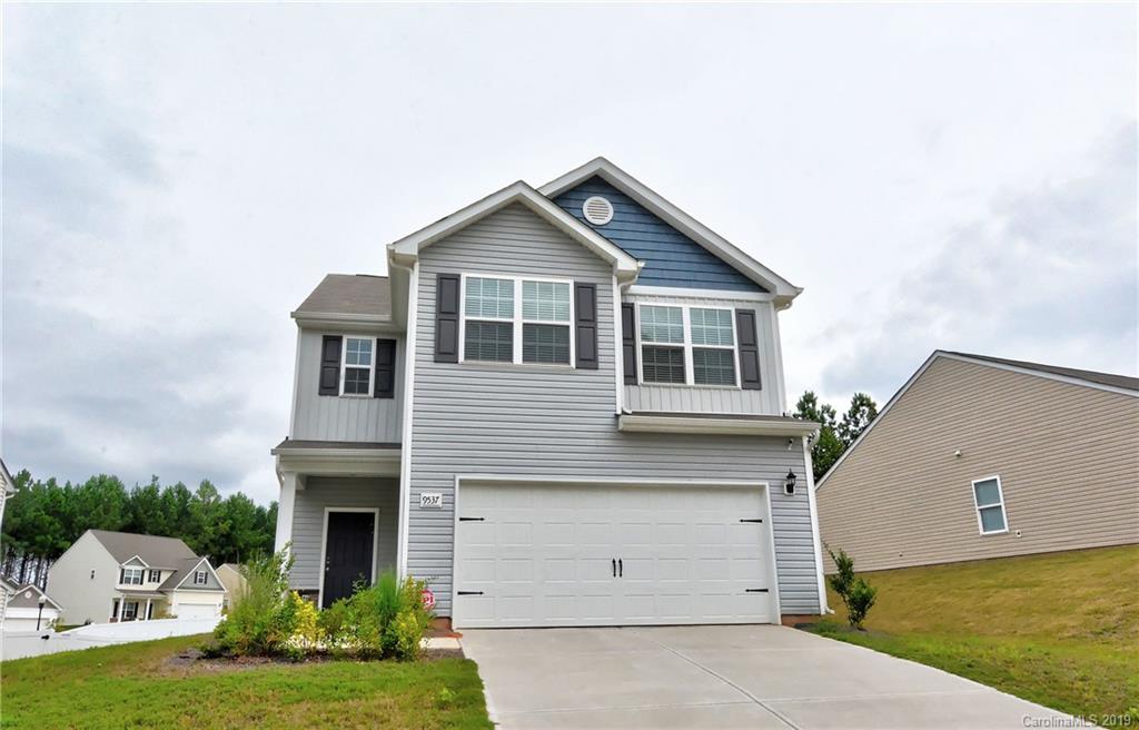 9537 Weikert Road Charlotte, NC 28215 - Photo 2 of 31 a front view of a house with a yard