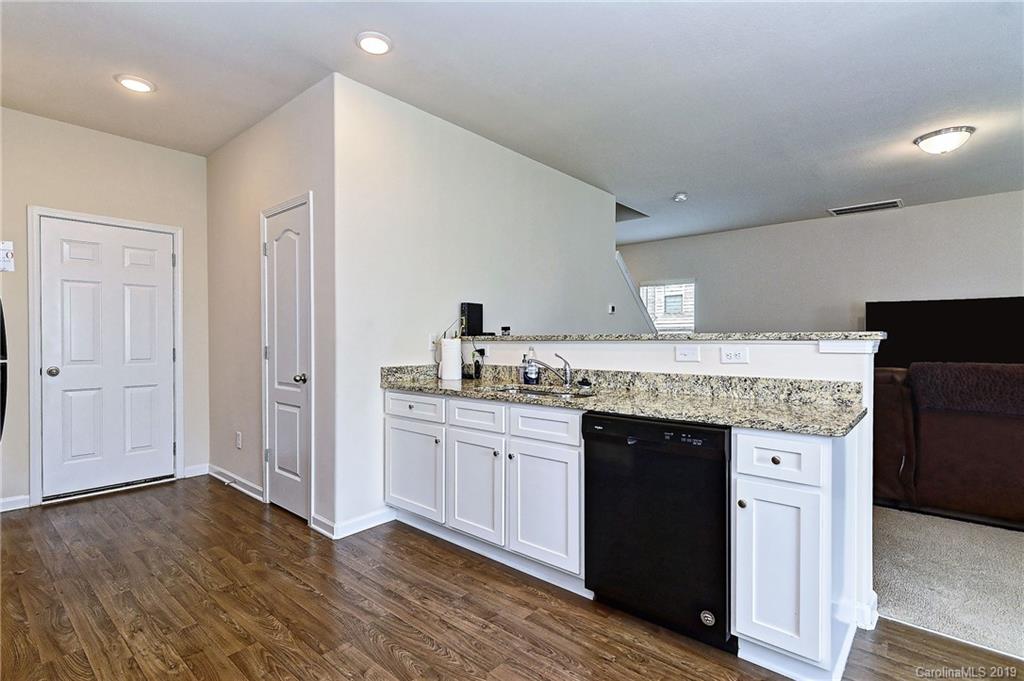 9537 Weikert Road Charlotte, NC 28215 - Photo 16 of 31 a kitchen with a sink and cabinets