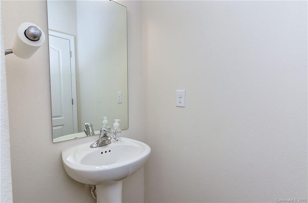 9537 Weikert Road Charlotte, NC 28215 - Photo 17 of 31 a bathroom with a sink and a mirror