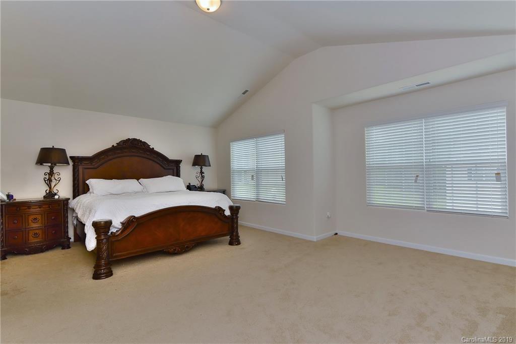 9537 Weikert Road Charlotte, NC 28215 - Photo 18 of 31 a bedroom with a bed and window