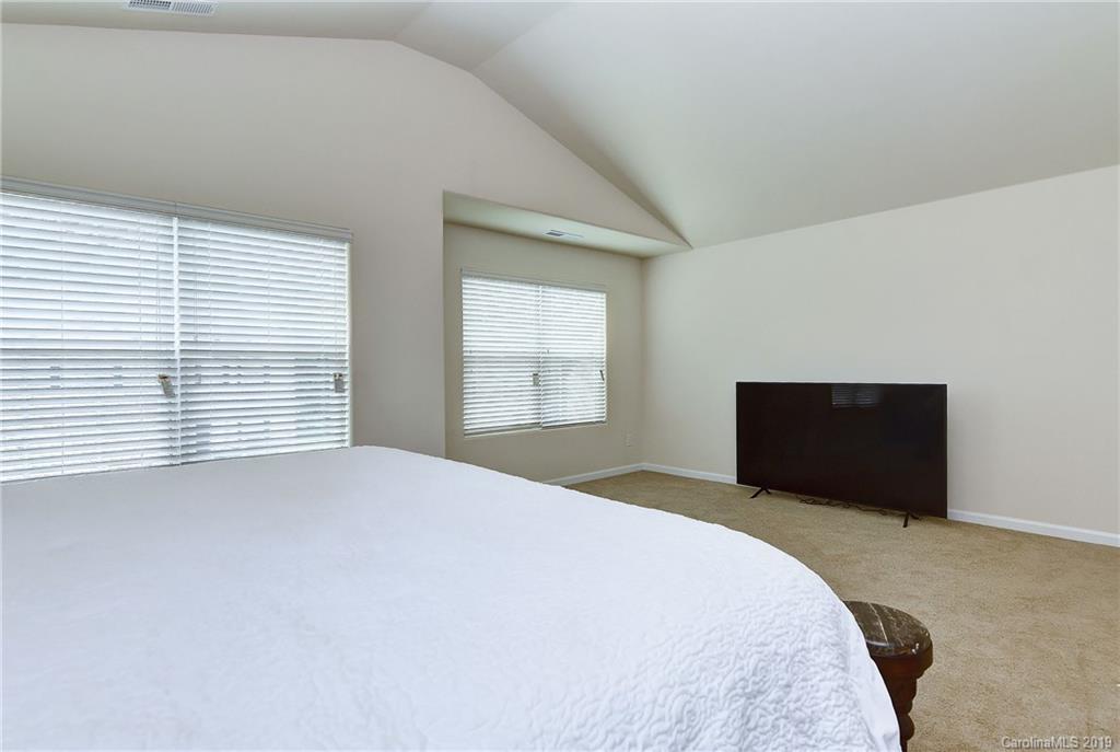 9537 Weikert Road Charlotte, NC 28215 - Photo 19 of 31 a bedroom with a bed and a window