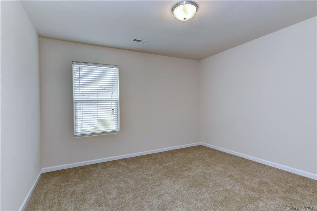 9537 Weikert Road Charlotte, NC 28215 - Photo 26 of 31 an empty room with a window