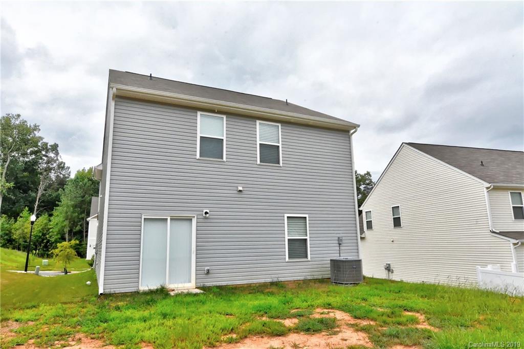 9537 Weikert Road Charlotte, NC 28215 - Photo 30 of 31 a view of a house with a yard