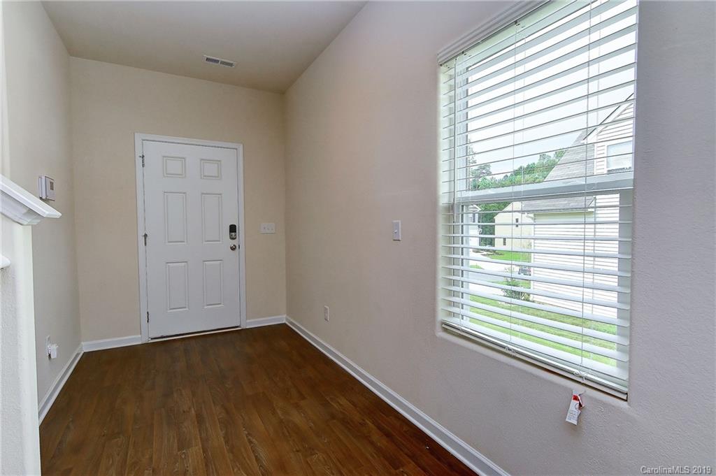 9537 Weikert Road Charlotte, NC 28215 - Photo 5 of 31 a view of a room that has a window in it