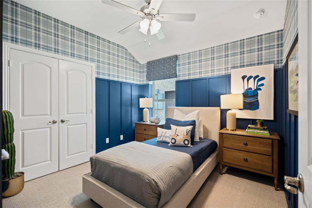 8716 Saratoga Street Pilot Point, TX 76258 - Photo 13 of 16 a bedroom with a bed and a chandelier