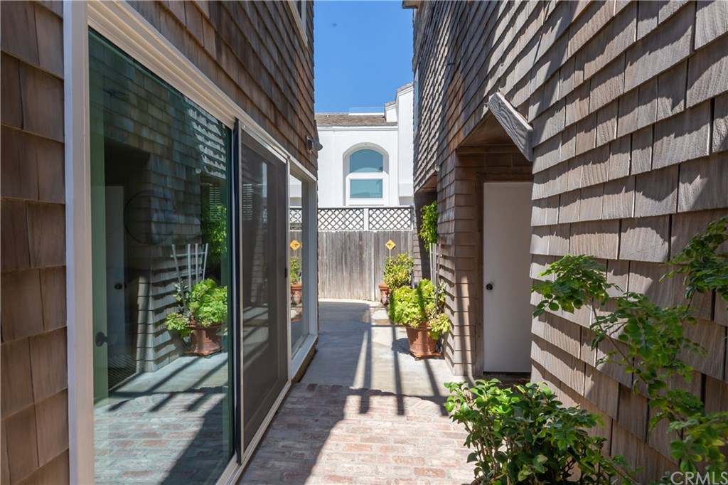 4 64th Place Long Beach, CA 90803 - Photo 33 of 58 Walkway between family room and entrance to both the garage and back apartment's front door
