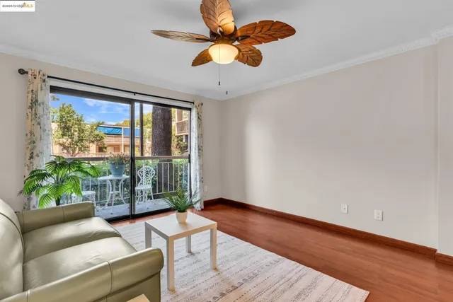 a view of livingroom with furniture wooden floor and windows
