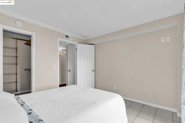 a bedroom with a bed and closet