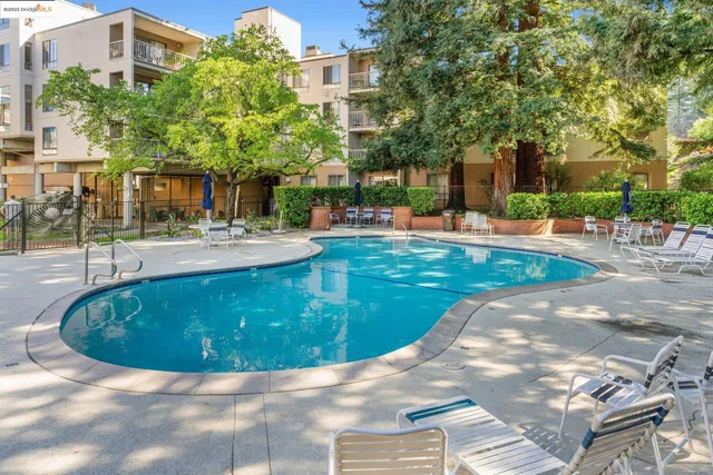 a view of a swimming pool with a sitting space