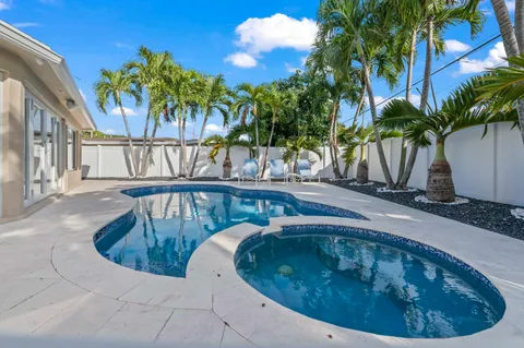 a view of swimming pool from a balcony