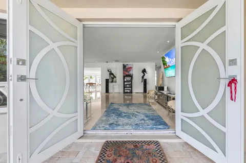 a view of a hallway with furniture and entryway