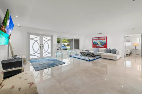 a living room with furniture and a rug