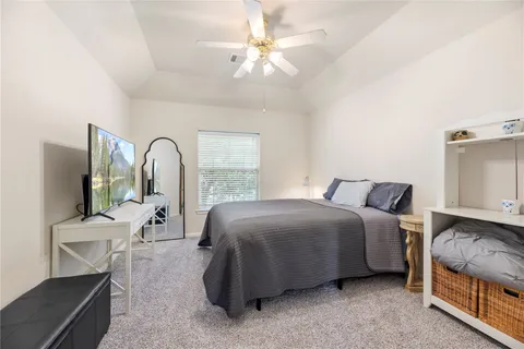 a bed room with a bed and a chair