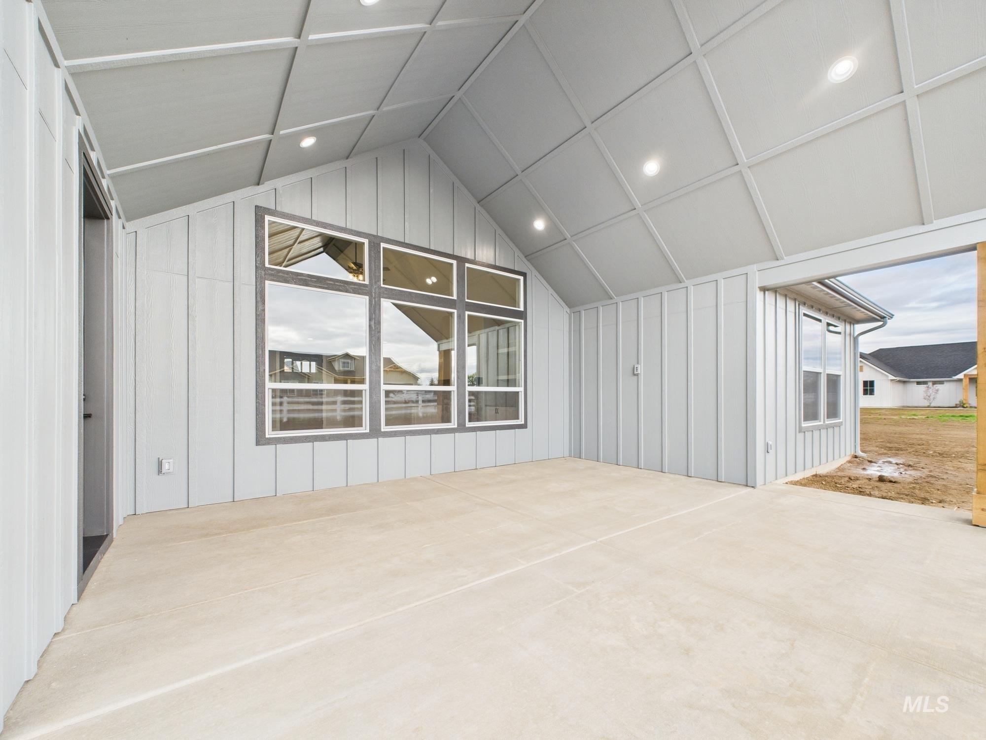 1910 Ruth Lane Emmett, ID 83617 - Photo 35 of 42 Additional living space featuring vaulted ceiling, recessed lighting, and a decorative wall