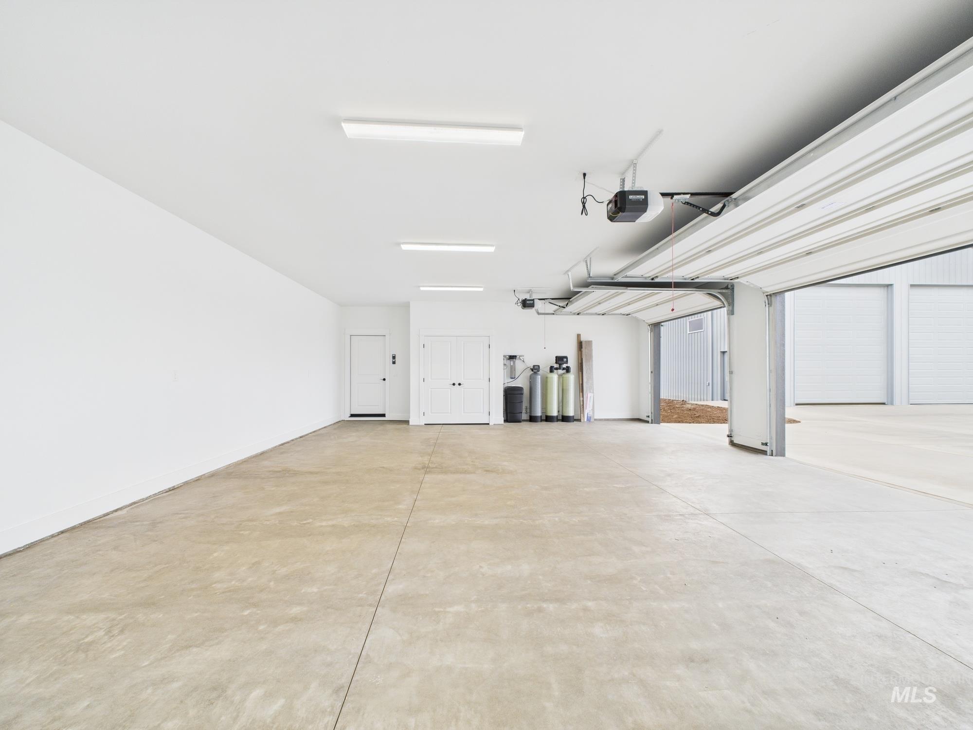 1910 Ruth Lane Emmett, ID 83617 - Photo 41 of 42 Garage featuring a garage door opener