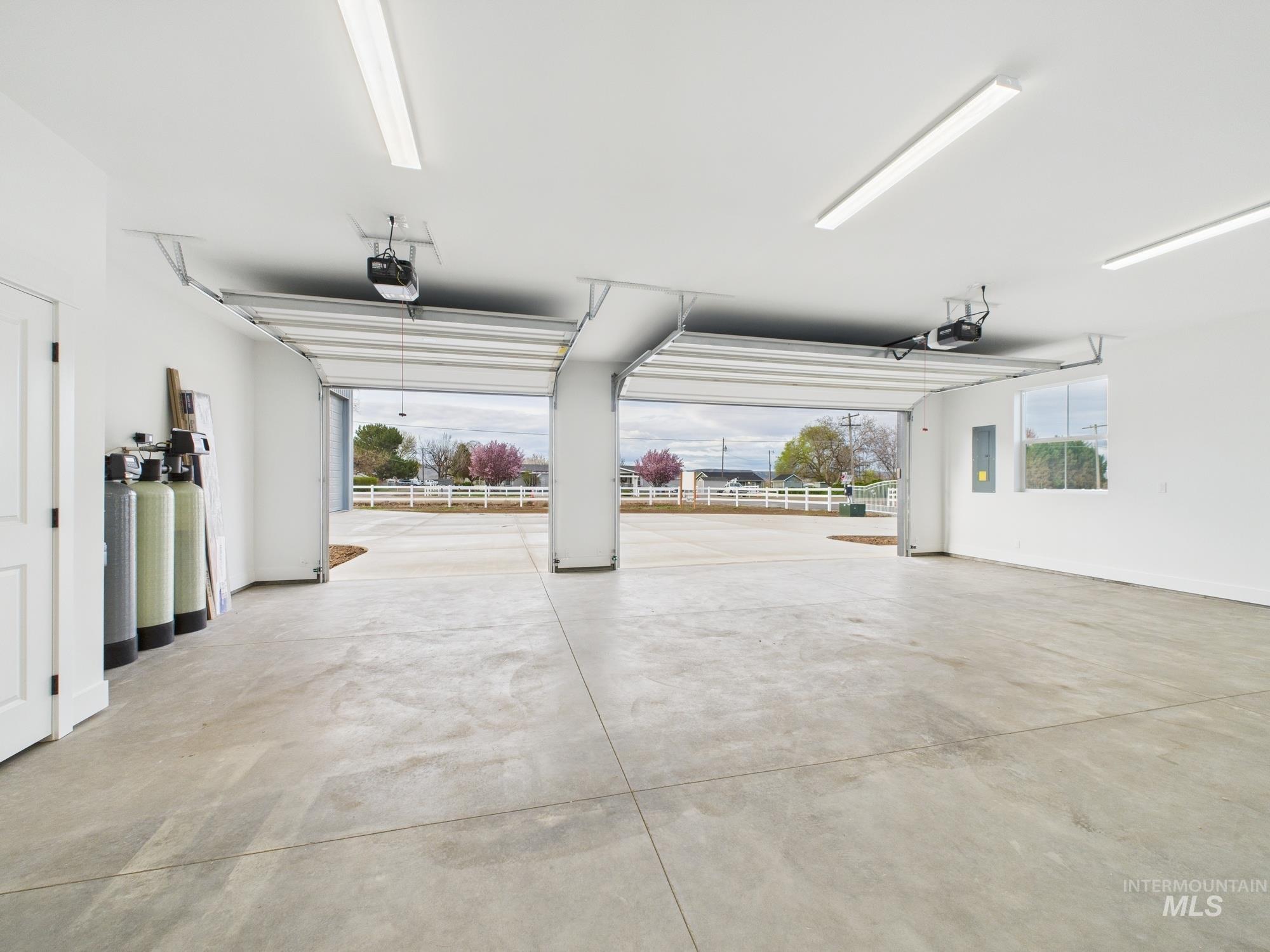 1910 Ruth Lane Emmett, ID 83617 - Photo 42 of 42 Garage with electric panel and a garage door opener