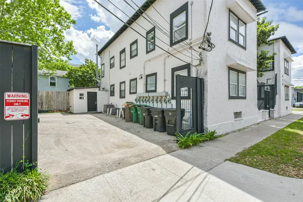 a front view of a building with garden