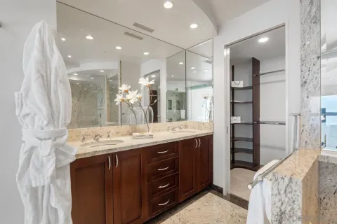 a bathroom with a double vanity sink and a mirror
