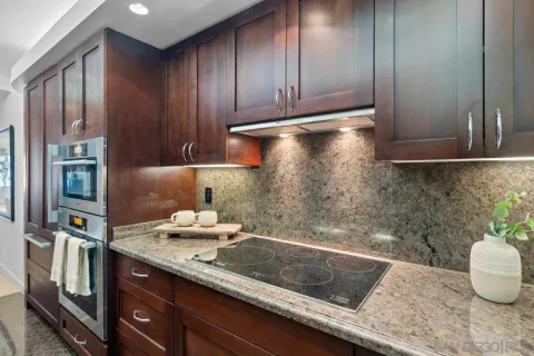 a kitchen with a sink and a refrigerator