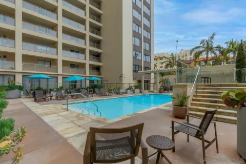a view of a swimming pool with chairs