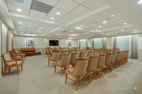 a room with pool table and windows