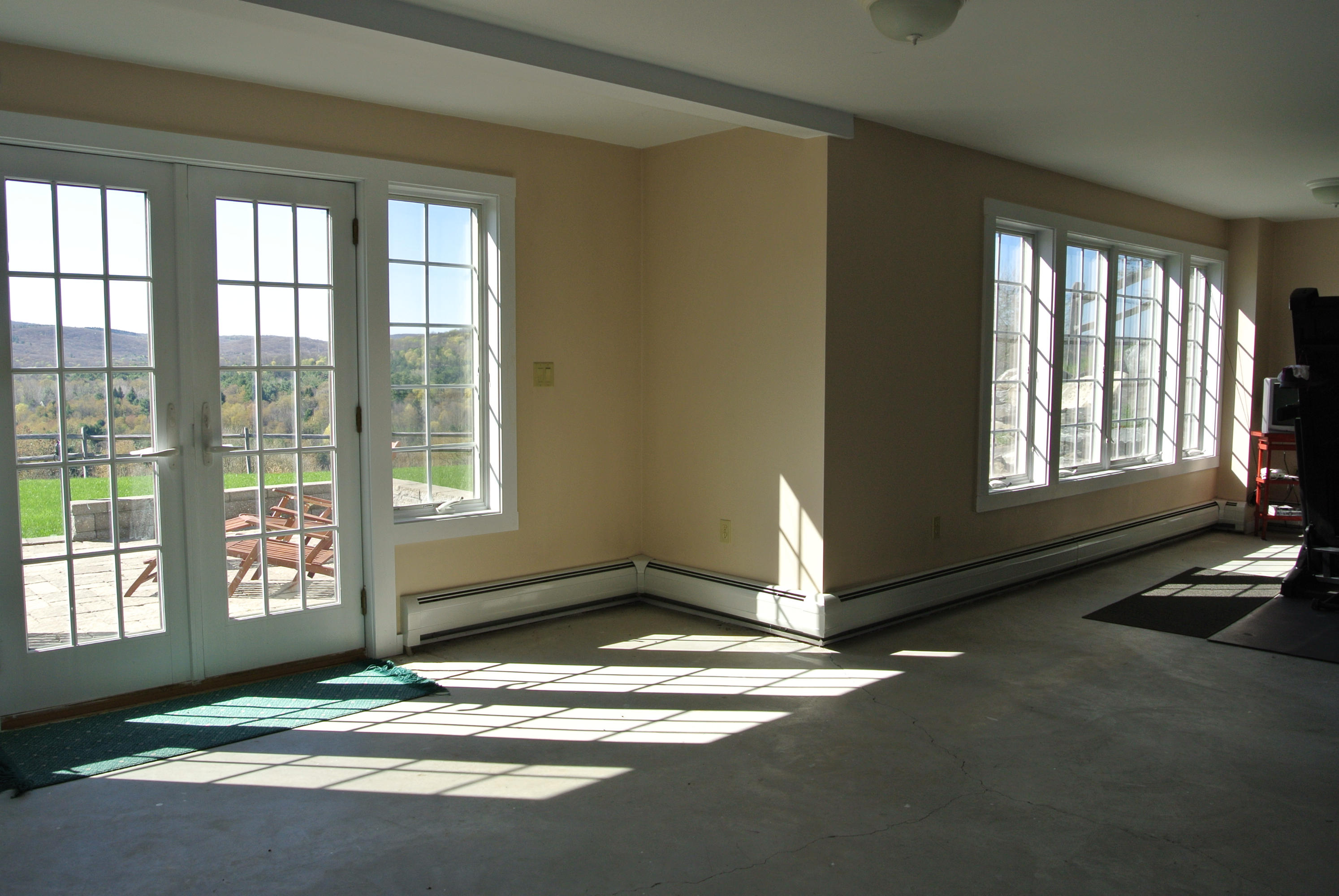58 Swamp Road West Stockbridge, MA 01266 - Photo 16 of 21 a view of an empty room with a fireplace and windows