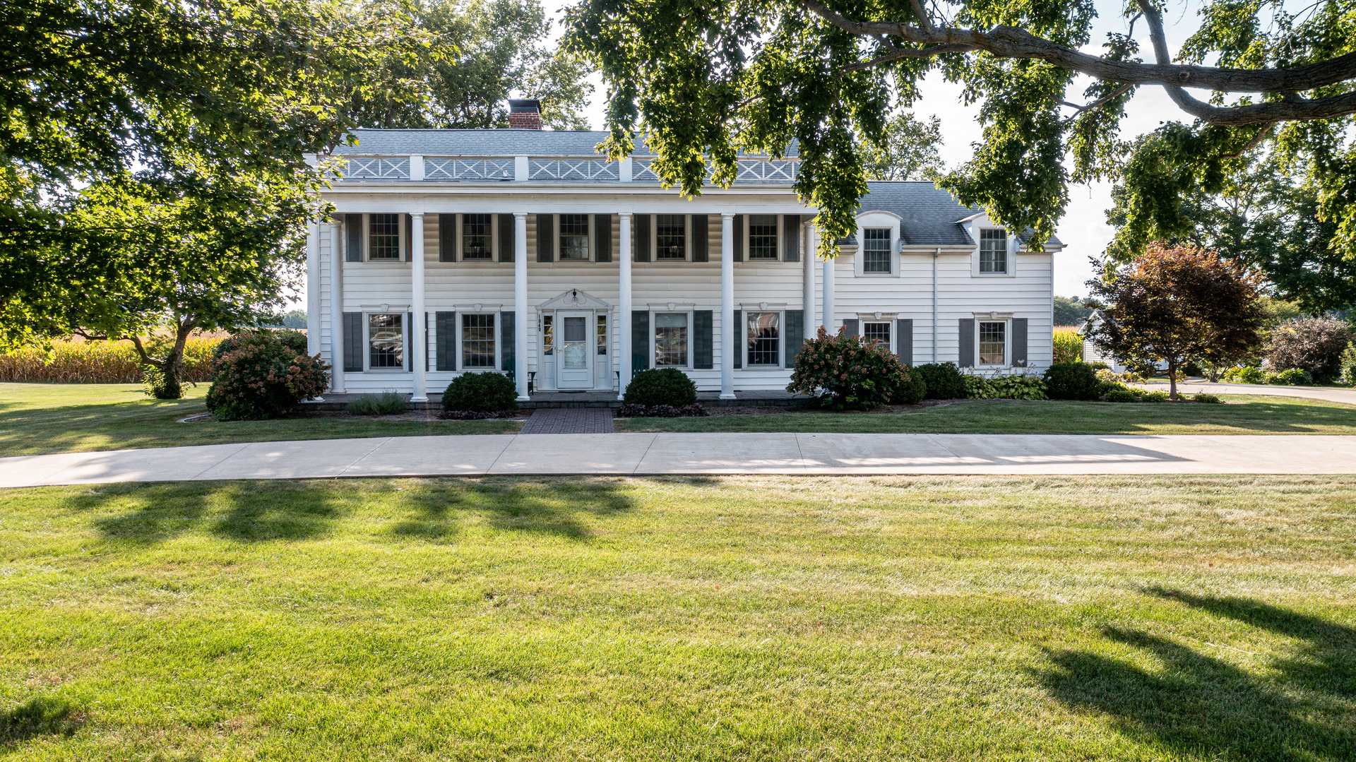 a view of house with outdoor space and swimming pool