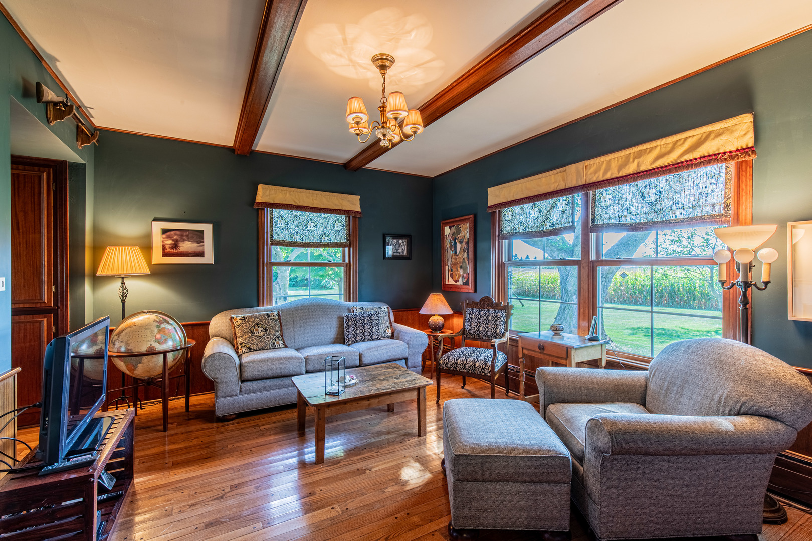 1840 South Main Street Princeton, IL 61356 - Photo 17 of 51 a living room with furniture a ceiling fan and a large window