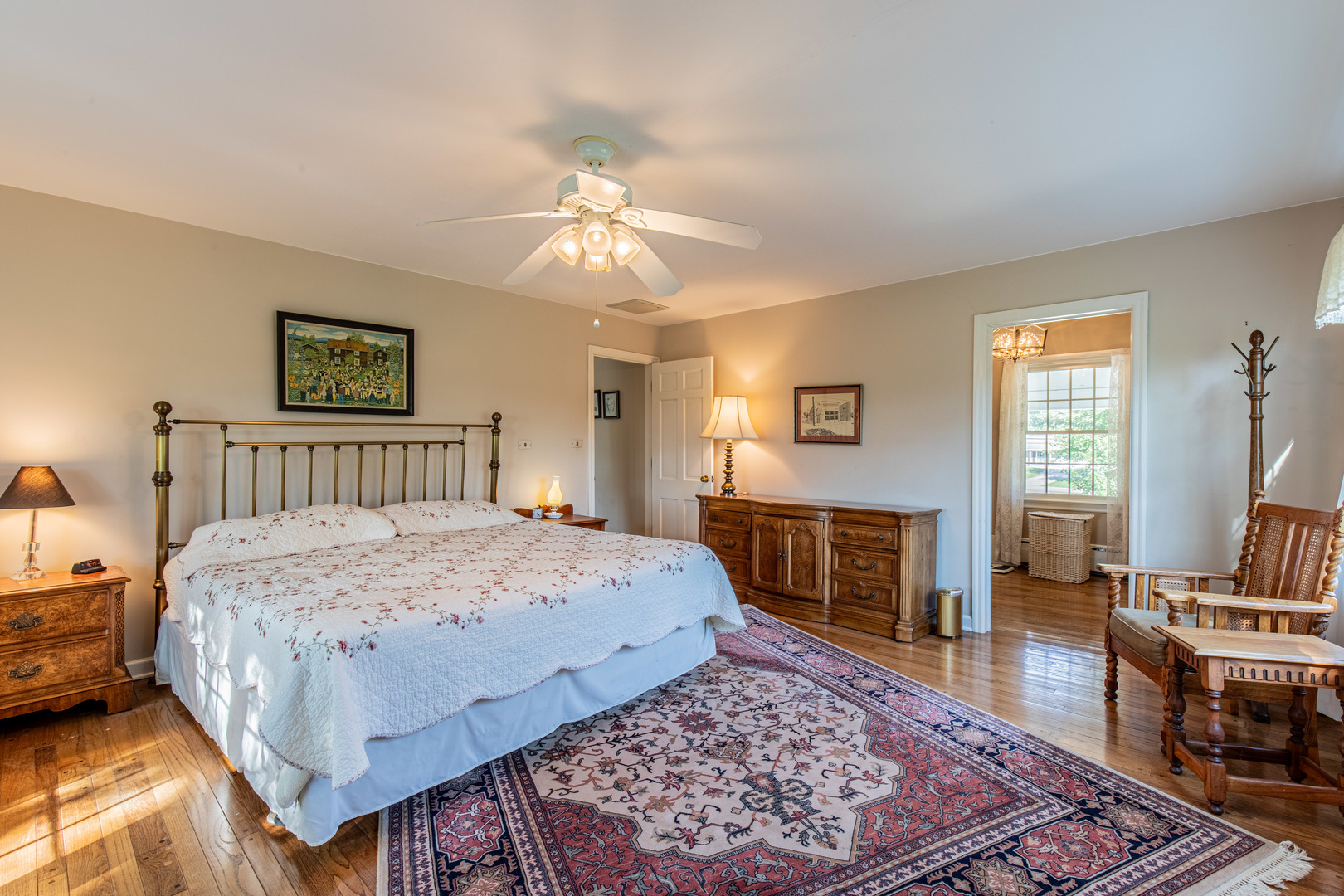 1840 South Main Street Princeton, IL 61356 - Photo 25 of 51 a bedroom with a bed and a chandelier