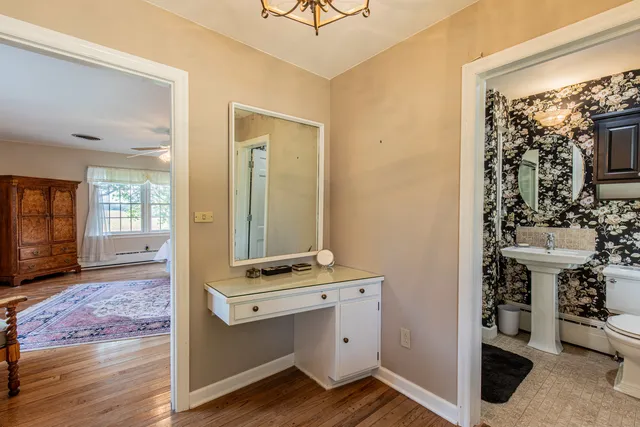 a room with wooden floor and window