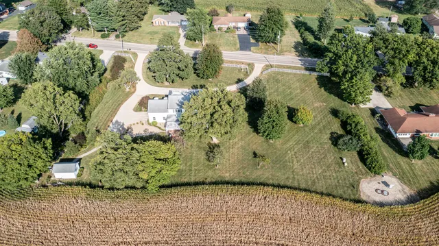 an aerial view of a houses with lake view