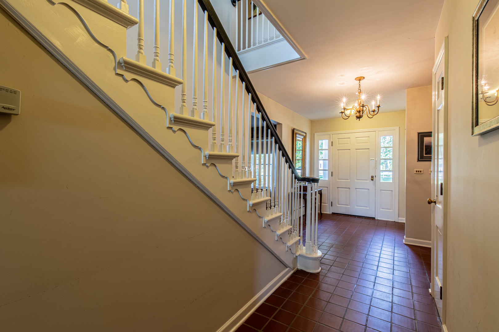 1840 South Main Street Princeton, IL 61356 - Photo 6 of 51 a view of a hallway with wooden floor and staircase