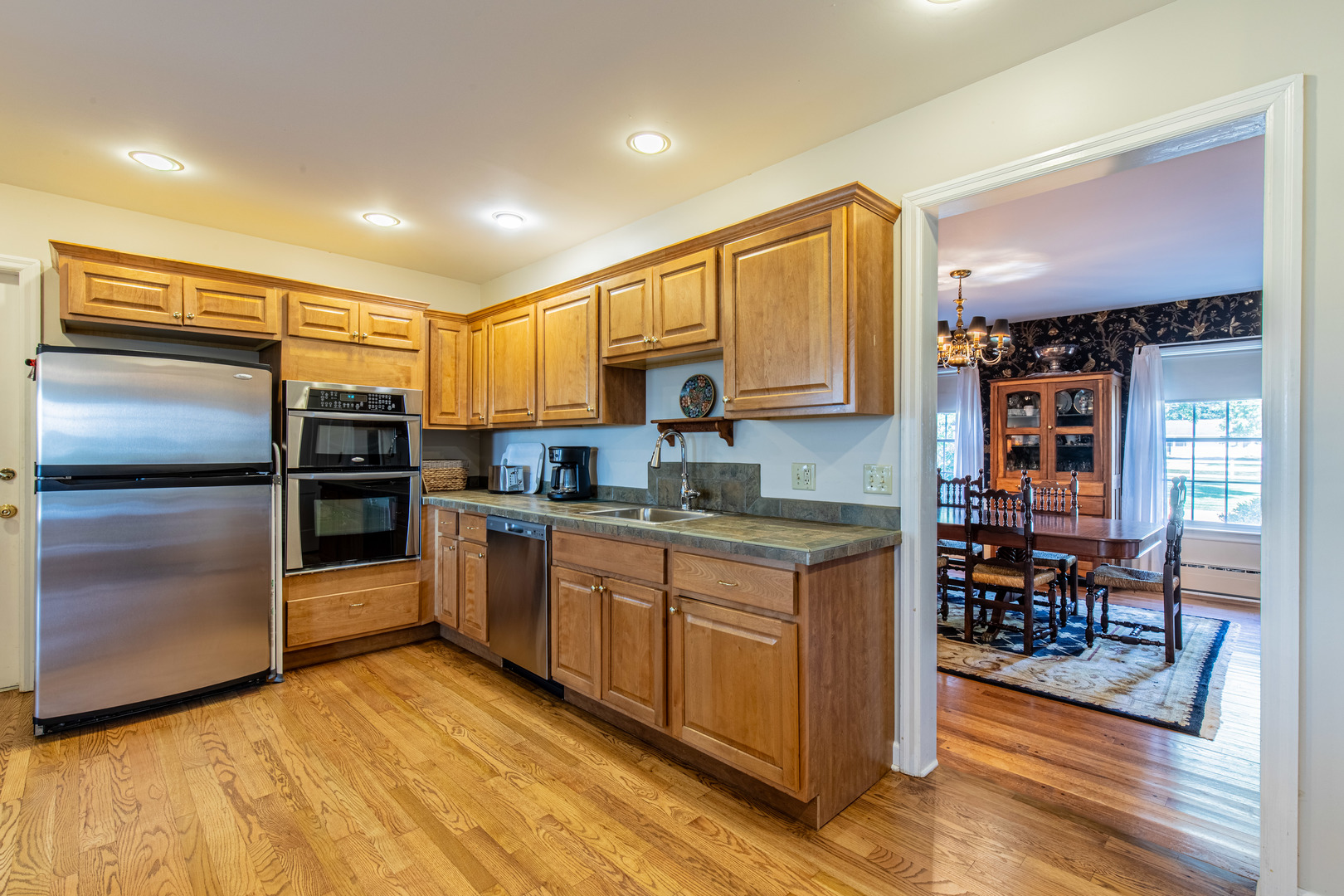1840 South Main Street Princeton, IL 61356 - Photo 10 of 51 a kitchen with stainless steel appliances granite countertop a refrigerator and a stove top oven