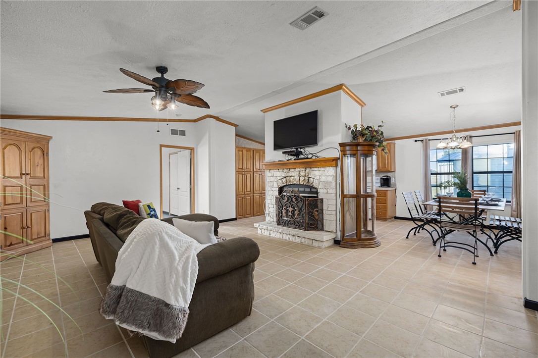 1761 Lcr 822 Groesbeck, TX 76642 - Photo 19 of 93 a living room with furniture a flat screen tv and a large window