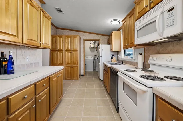 a bathroom with a toilet sink and shower