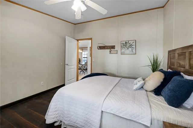 a bathroom with a granite countertop toilet a sink and a shower