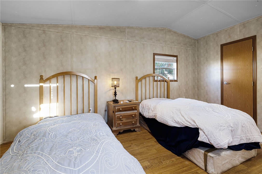 1761 Lcr 822 Groesbeck, TX 76642 - Photo 37 of 93 a bed sitting in a bedroom next to a window