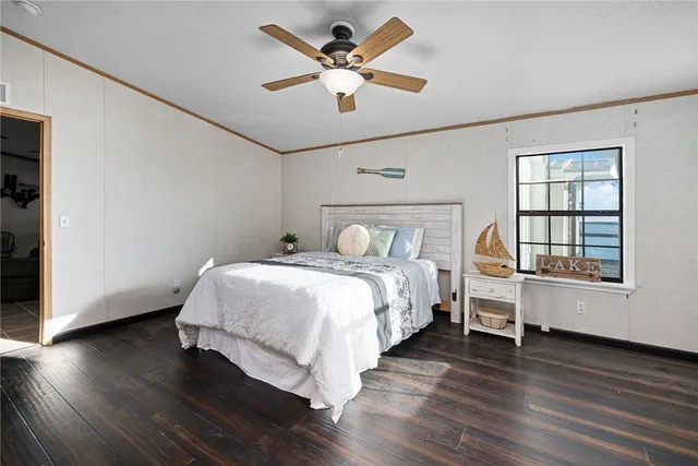 a view of a lake with a table and chairs