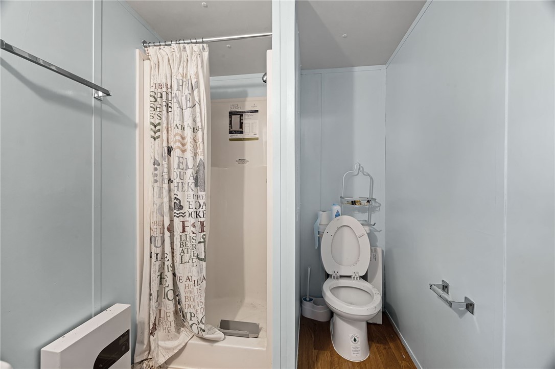 1761 Lcr 822 Groesbeck, TX 76642 - Photo 39 of 93 a bathroom with a granite countertop toilet a sink and a shower