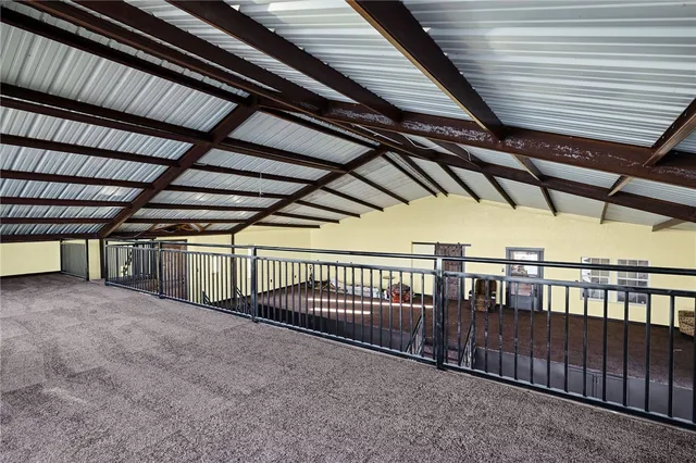 an aerial view of a house with a ocean view