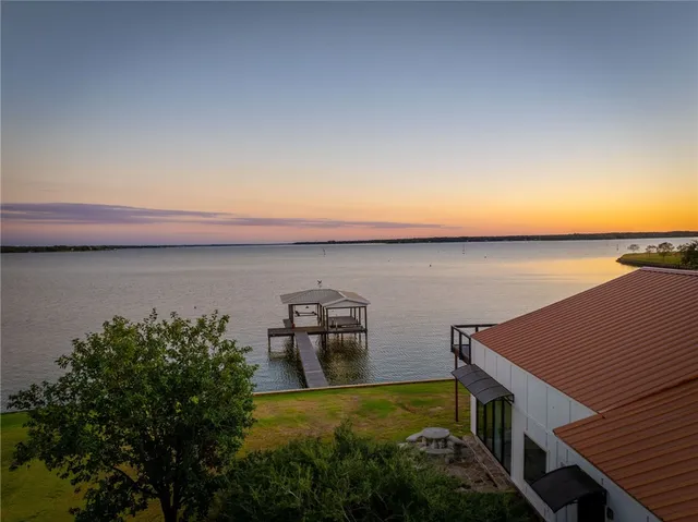 a view of outside space with a lake view