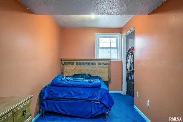 a view of a livingroom with wooden floor and a window